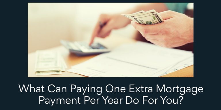 hand holding money and calculating with papers on a desk