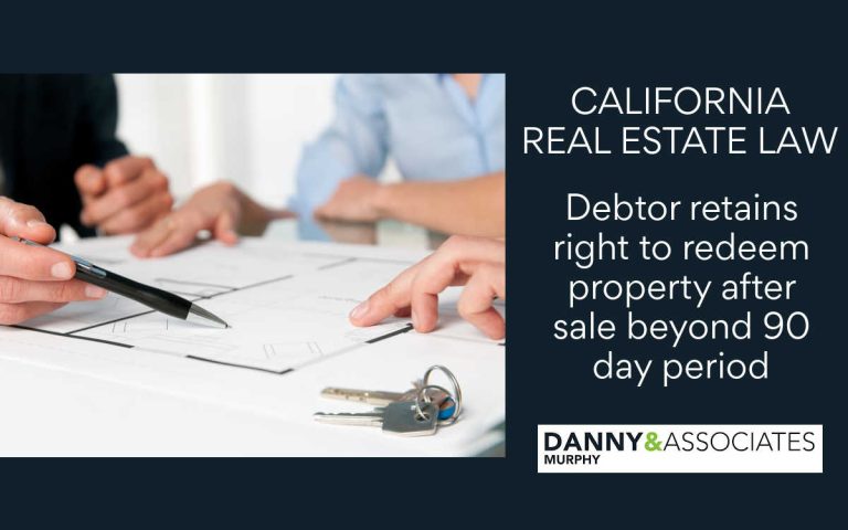 hand holding pen over document with set of keys off to side