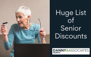 image of senior looking at a credit card with text saying huge list of senior discounts