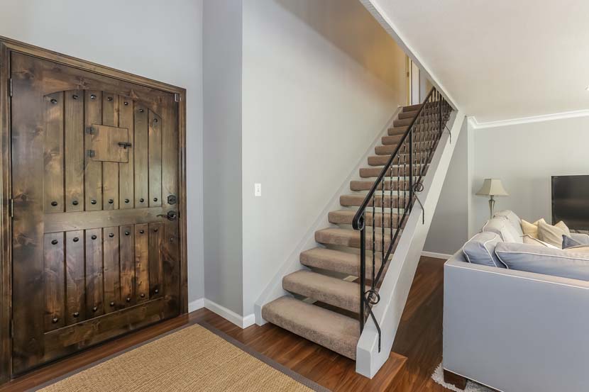 Dual paned windows make for plentiful natural light and new plantation shutters for privacy and a touch of sophistication. The open floor plan downstairs features a large kitchen with formal dining area and clear lines of site to the living room with a wall of windows and slider to the backyard, and a den with a cozy fireplace and yard access. 