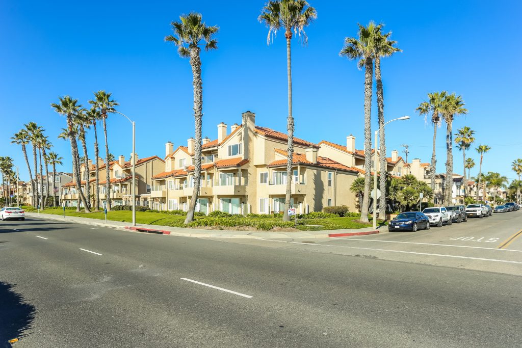 2000 Pacific Coast Highway #102, Huntington Beach is a beautifully remodeled beachfront condo with peak-a-boo ocean views featuring 2 beds / 2 1/2 baths!