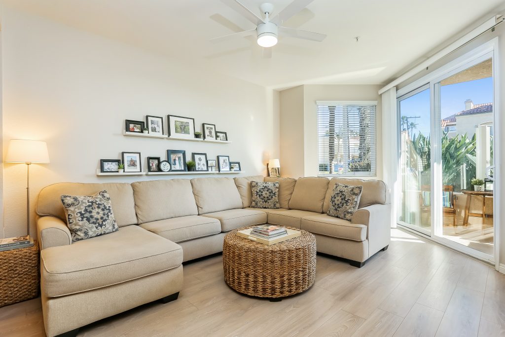 2000 Pacific Coast Highway #102, Huntington Beach is a beautifully remodeled beachfront condo with peak-a-boo ocean views featuring 2 beds / 2 1/2 baths!