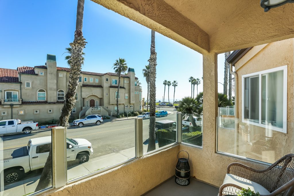 2000 Pacific Coast Highway #102, Huntington Beach is a beautifully remodeled beachfront condo with peak-a-boo ocean views featuring 2 beds / 2 1/2 baths!