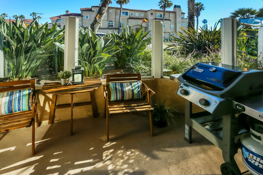 2000 Pacific Coast Highway #102, Huntington Beach is a beautifully remodeled beachfront condo with peak-a-boo ocean views featuring 2 beds / 2 1/2 baths!