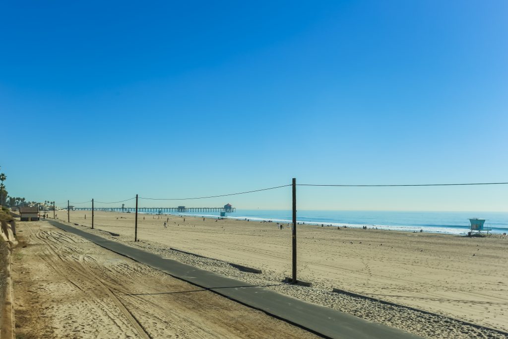 2000 Pacific Coast Highway #102, Huntington Beach is a beautifully remodeled beachfront condo with peak-a-boo ocean views featuring 2 beds / 2 1/2 baths!