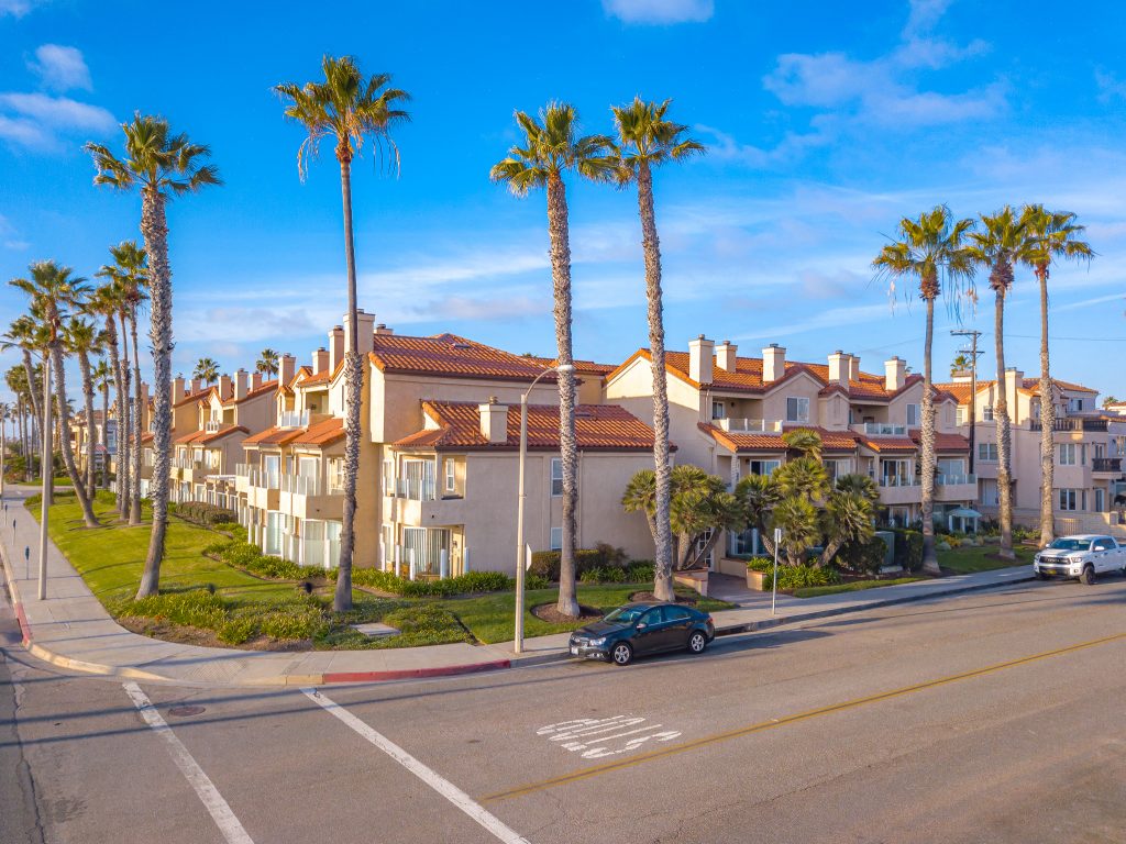 2000 Pacific Coast Highway #102, Huntington Beach is a beautifully remodeled beachfront condo with peak-a-boo ocean views featuring 2 beds / 2 1/2 baths!