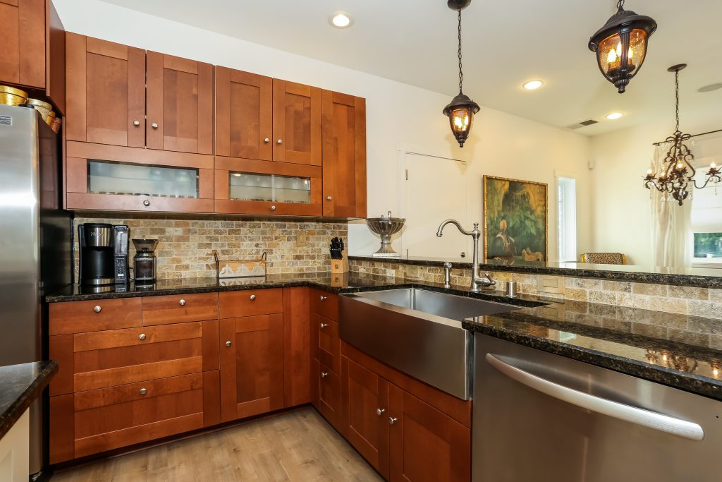 island kitchen with black countertops 