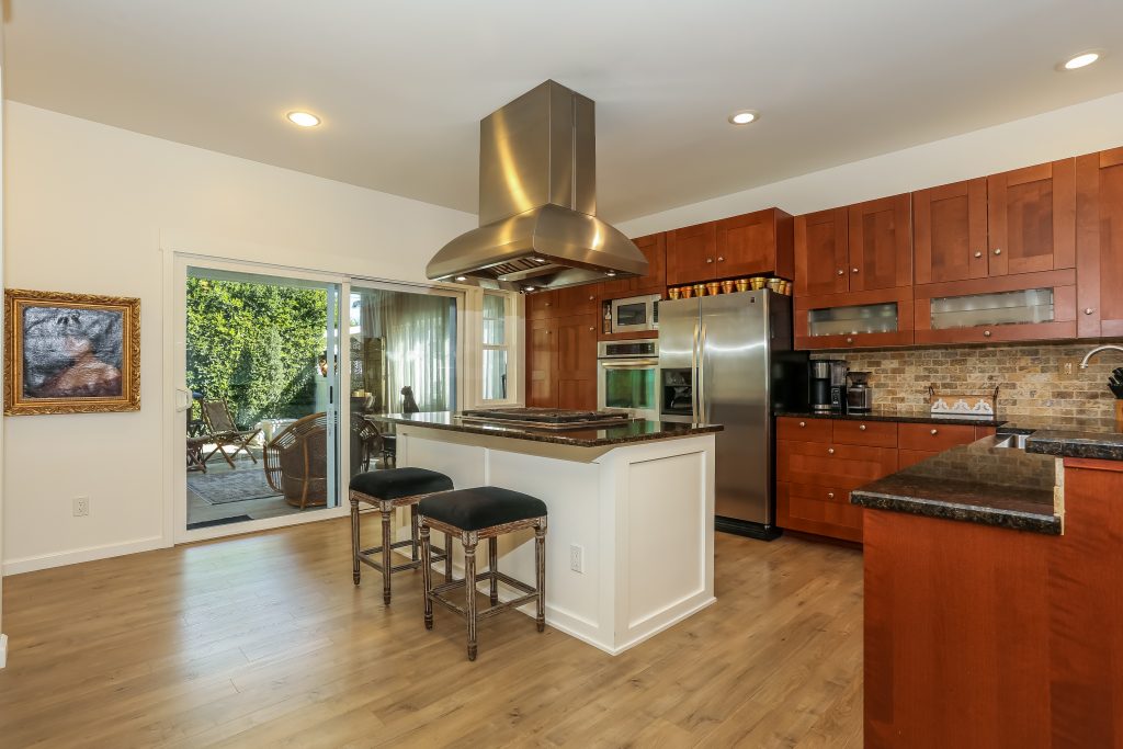 island kitchen with upgraded countertops and cabinets