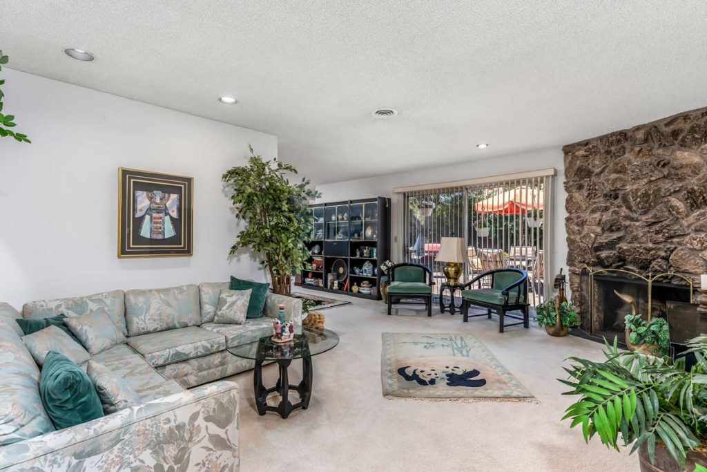 living room with couch and sliding door to backyard