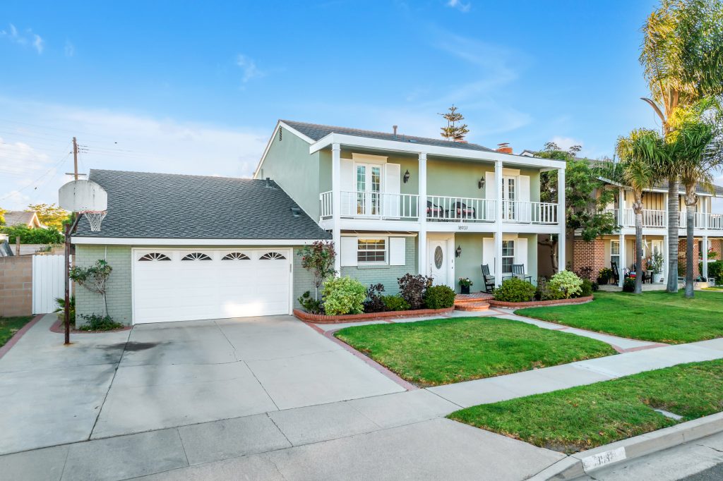 image showing the full front of the home with driveway and garage. 