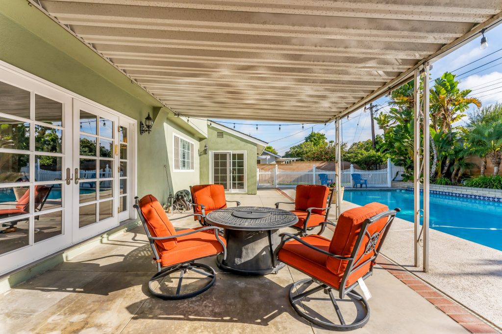 entertainers backyard with seating and pool