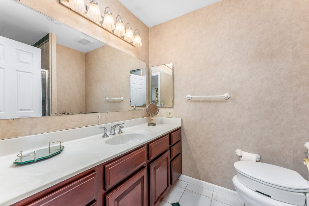 hallway bathroom with two sinks