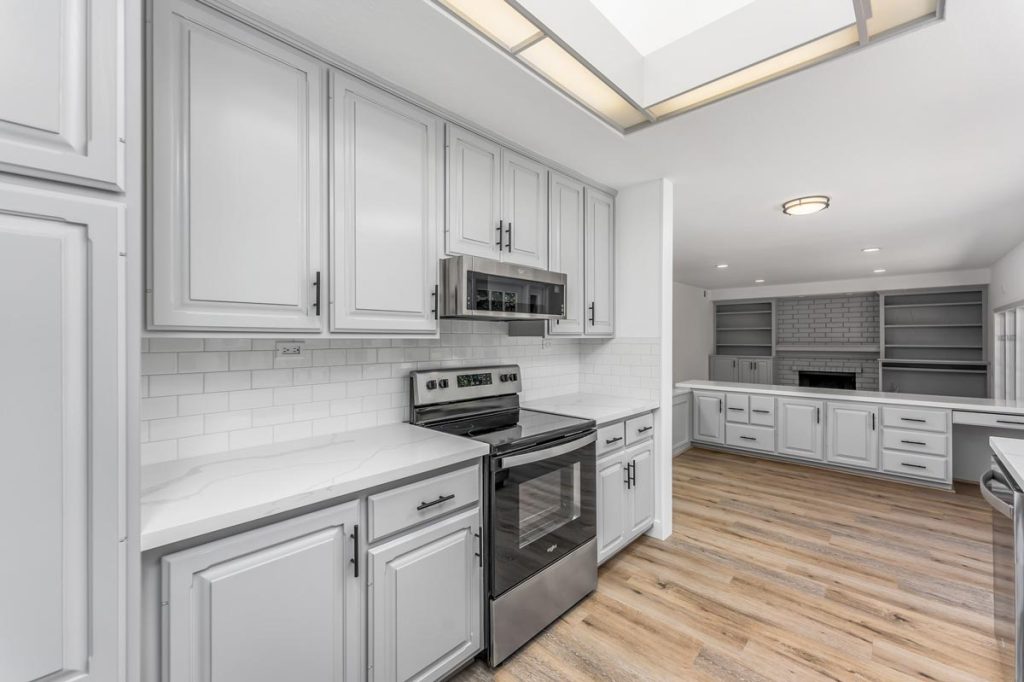 view of kitchen showing the range and microwave