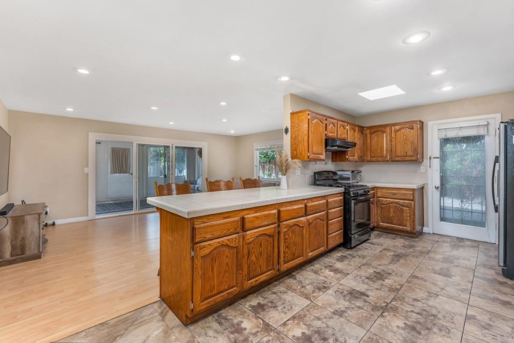 view of kitchen bar looking out on to the family room