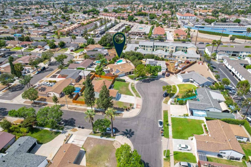 aerial view with arrow pointing to featured house