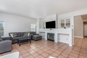 family room with fireplace and couch