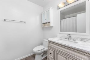 updated bathroom with vanity and toilet