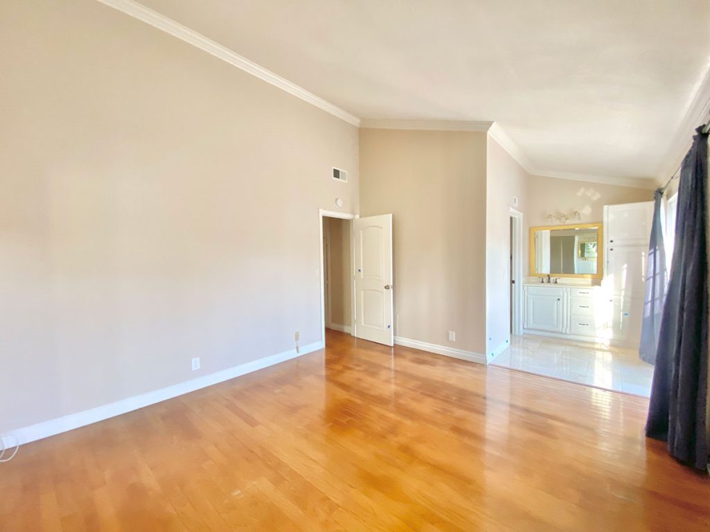 empty master bedroom with vaulted ceilings