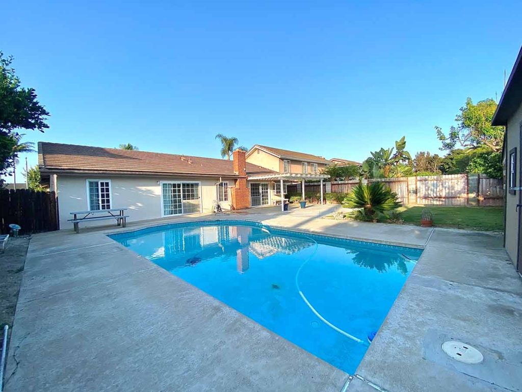 pool with house in background