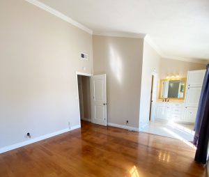 empty master bedroom with vaulted ceilings