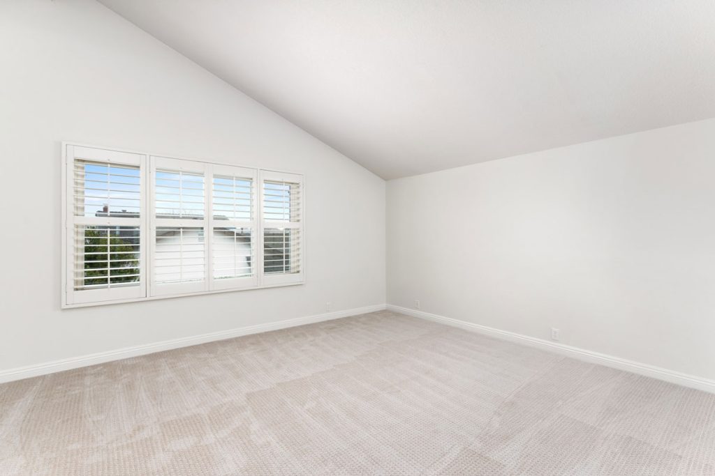 master bedroom with vaulted ceilings