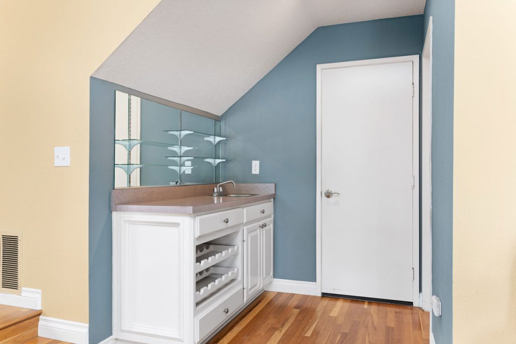 wet bar and door with access to garage