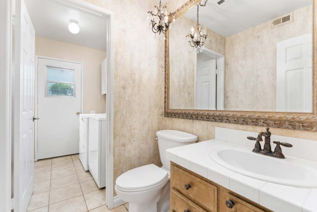 bathroom with laundry room attached