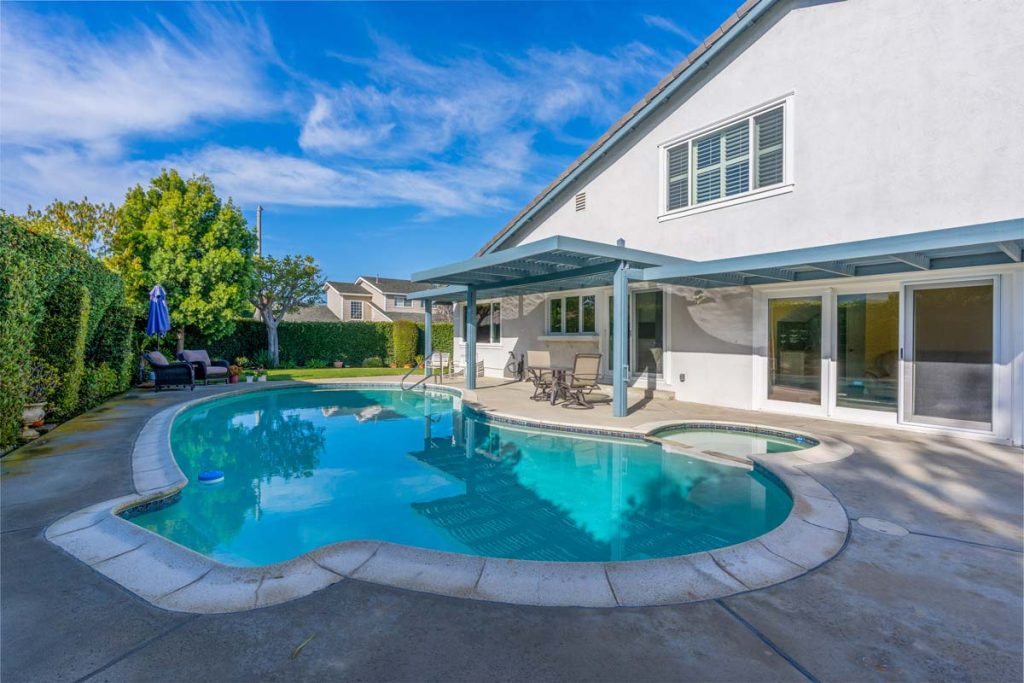 pool and house in backyard