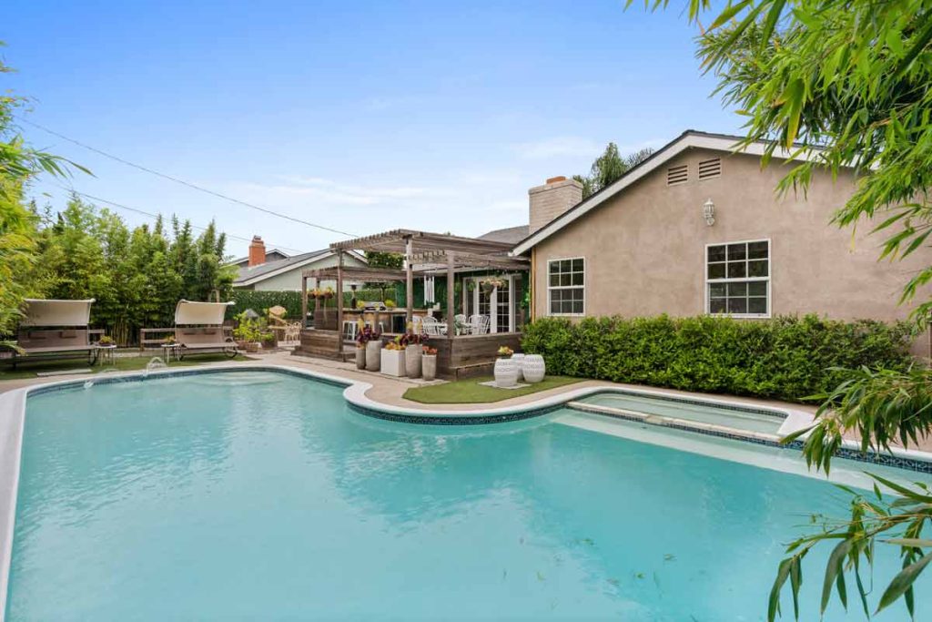 pool with house in background