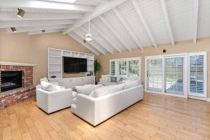 living room with vaulted white ceiling