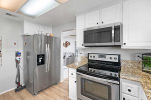 kitchen showing refrigerator, range and microwave