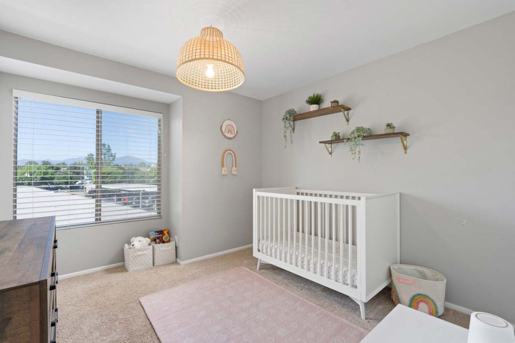 baby's room with crib and shelves