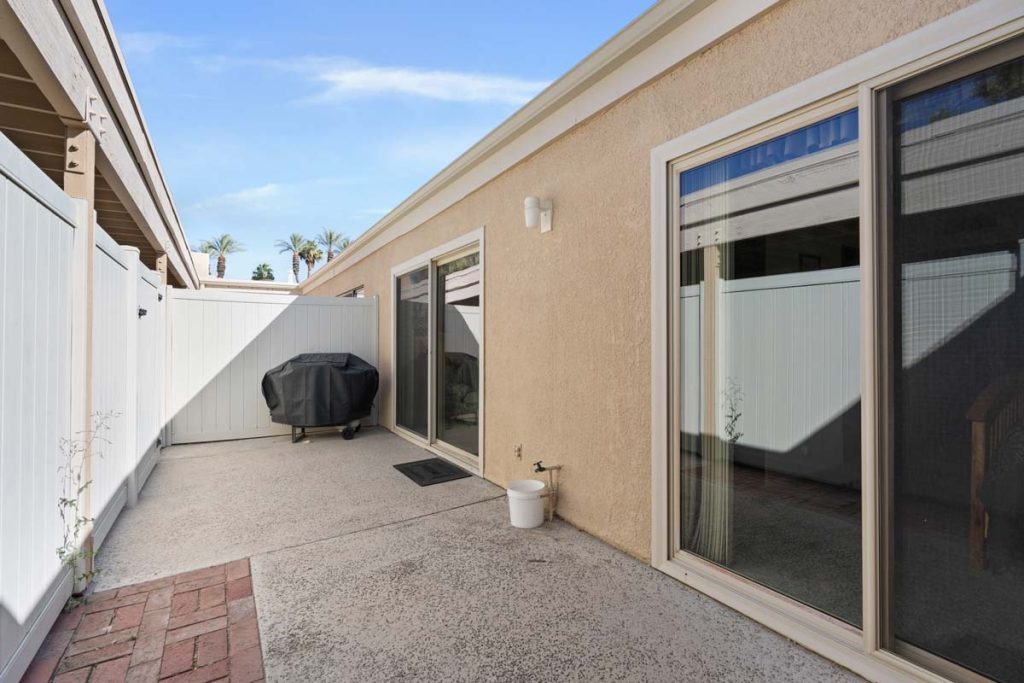 small backyard with sliding glass doors