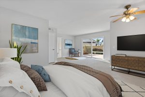 large master bedroom with sliding glass door to back yard