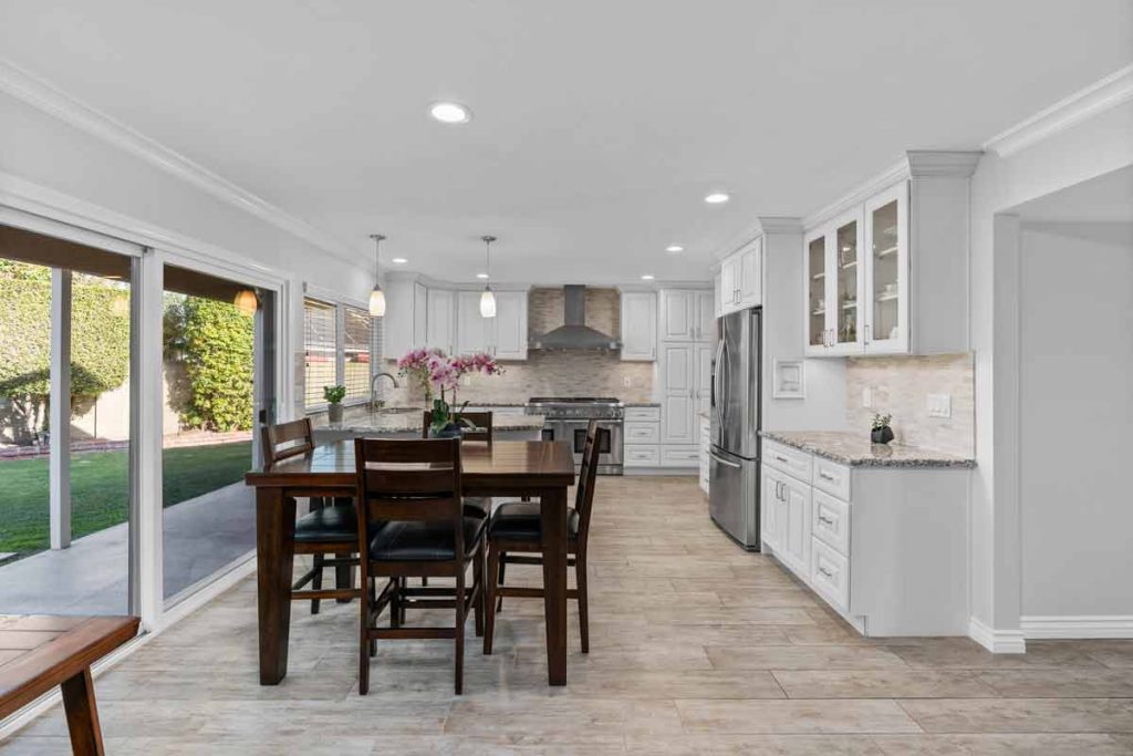 dining and kitchen with sliding glass door to backyard