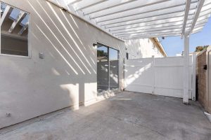 patio space with slider leading into 9908 Continental Drive, Huntington Beach