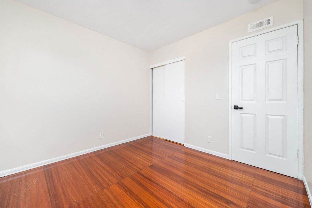empty bedroom with laminate flooring