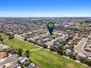 aerial view of 8572 Whitesails Circle, Huntington Beach with arrow pointing to house