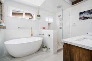 updated bathroom with soaking stand alone tub