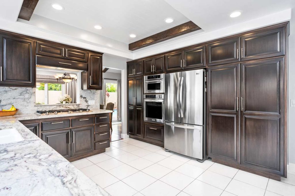 kitchen with dark cabinets and stone countertops