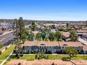 aerial view of condo for sale with arrow pointing to home.