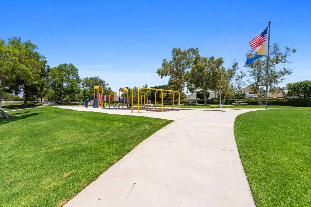 community playground with grass and side walks