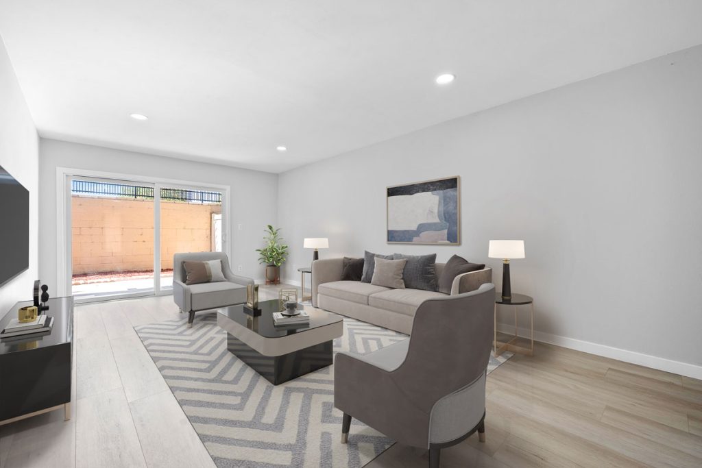 staged living room with couch, two chairs and a coffee table