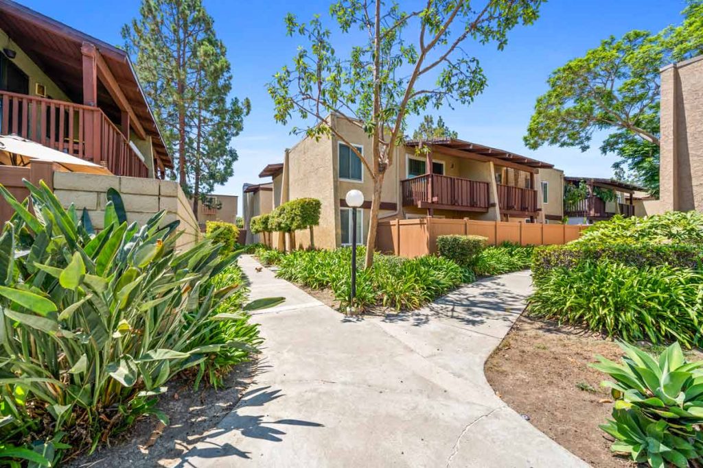 exterior of condo showing walking path between homes