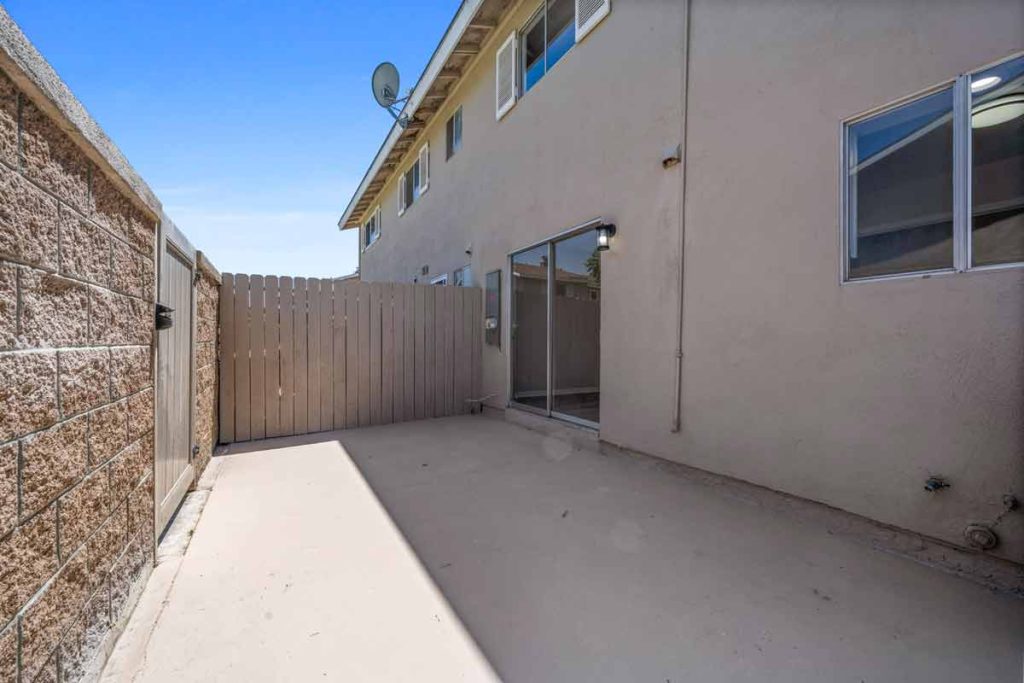 patio of 9867 Continental Drive, Huntington Beach with block wall and gate