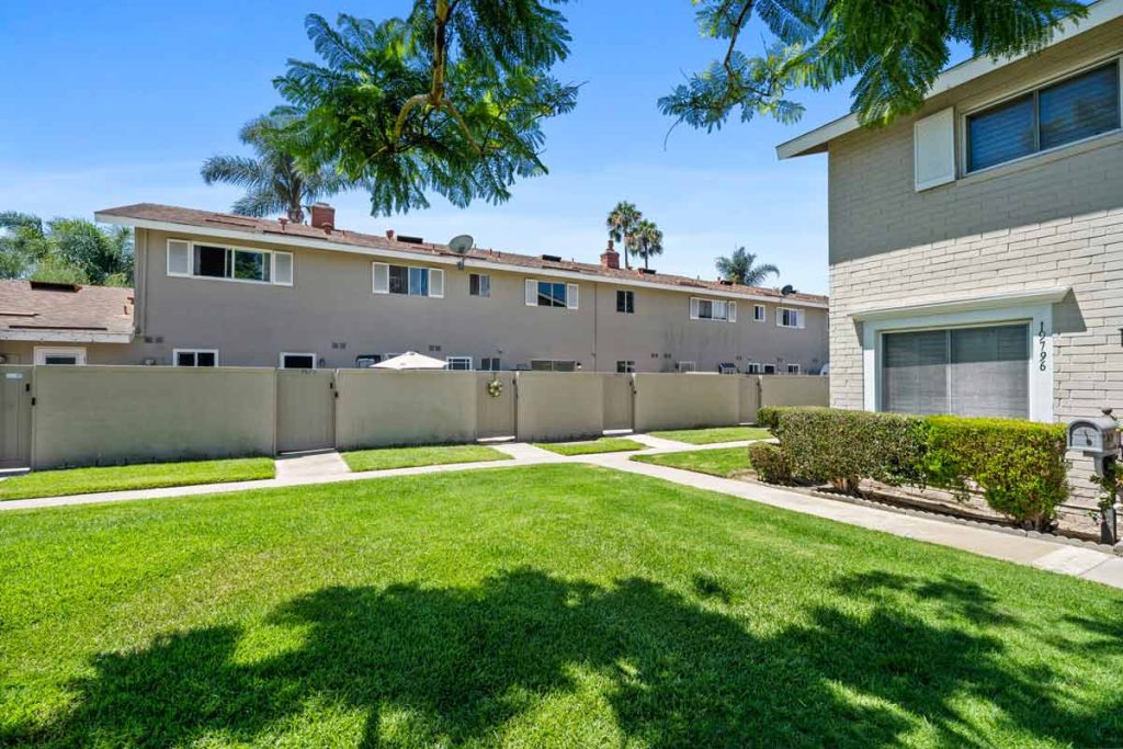 back gate of 9867 Continental Drive, Huntington Beach leading to large grassy area