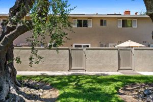 view of the fence and gate of the patio and home