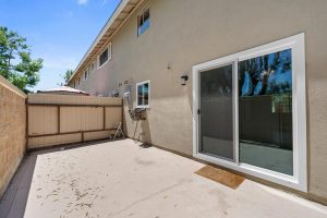 patio with sliding glass doors leading to home