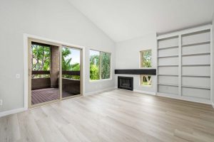 living room with fireplace and sliding glass door leading to balcony