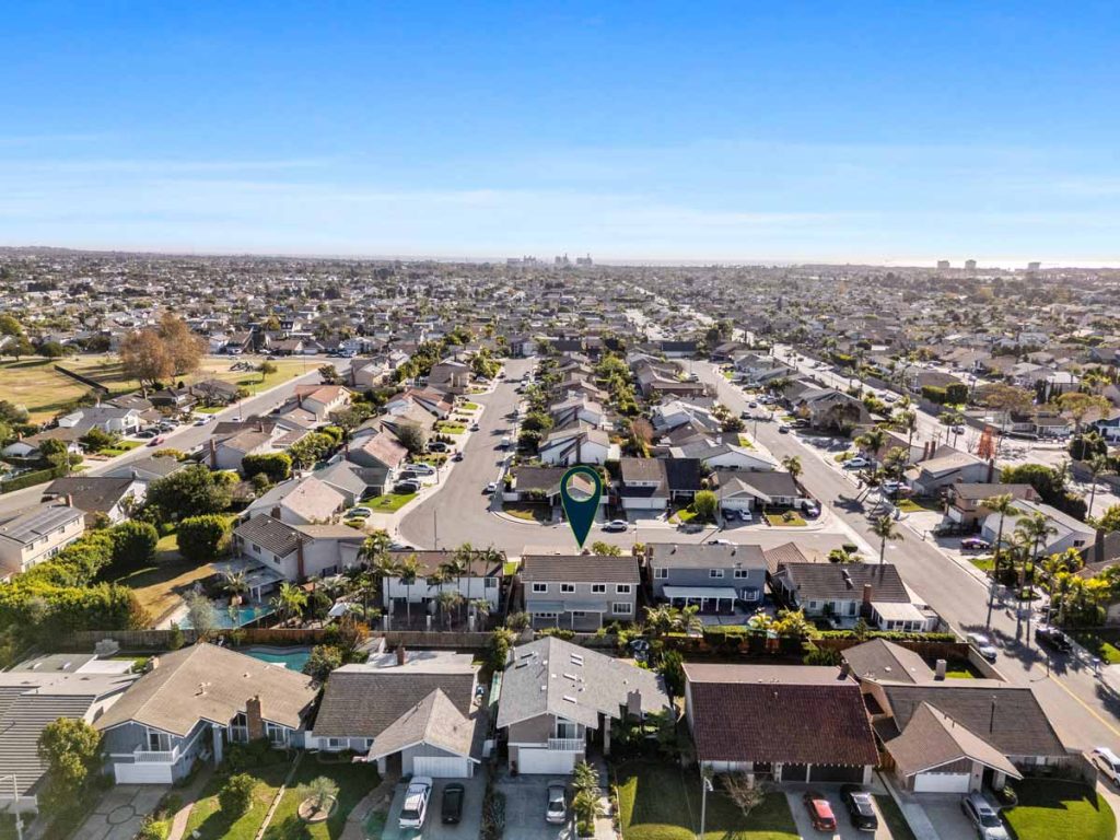 aerial view of neighborhood with an arrow pointing to 8561 pierre drive